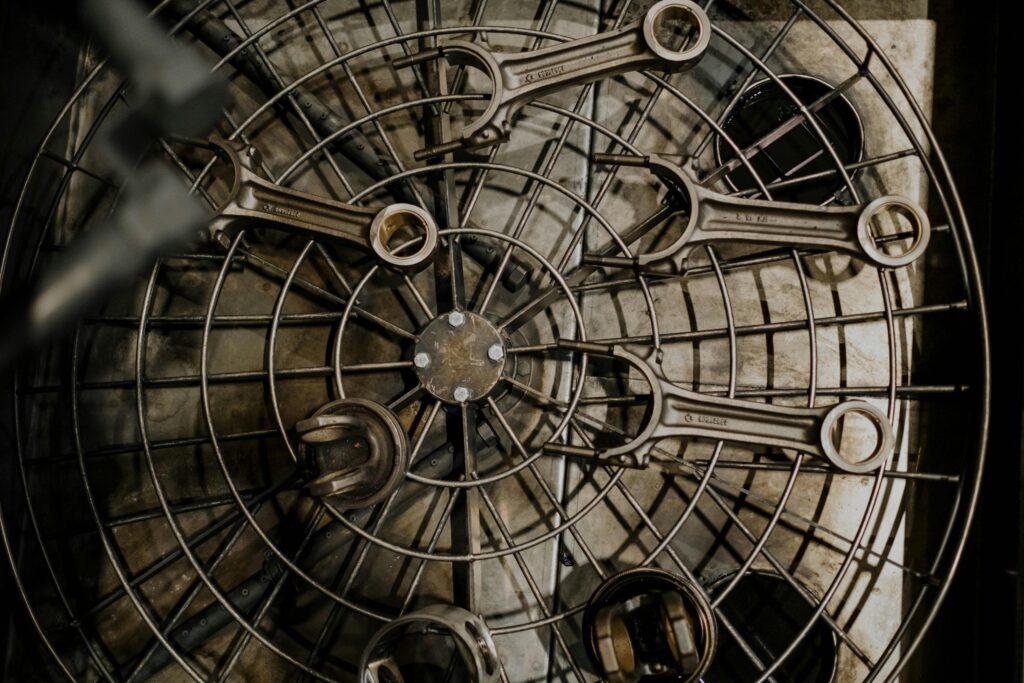 Top view of metal wrenches arranged on a grid in an industrial setting.